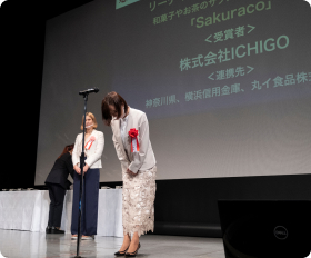 Sakuraco CEO accepting award at Cool Japan event.